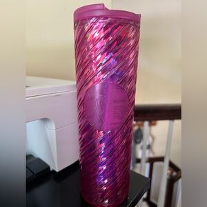 Fluorescent pink Starbucks cup from Christmas.